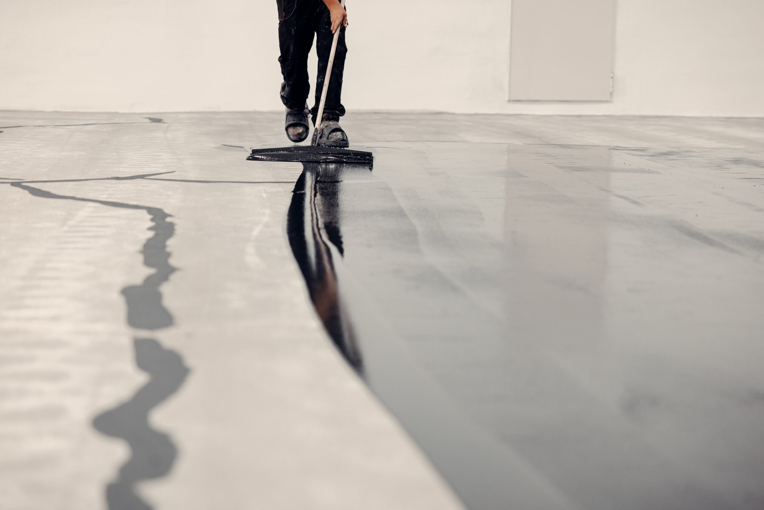 Amazing shot of how epoxy resin is applied. grey coating Reliaco Painting Fishers, IN