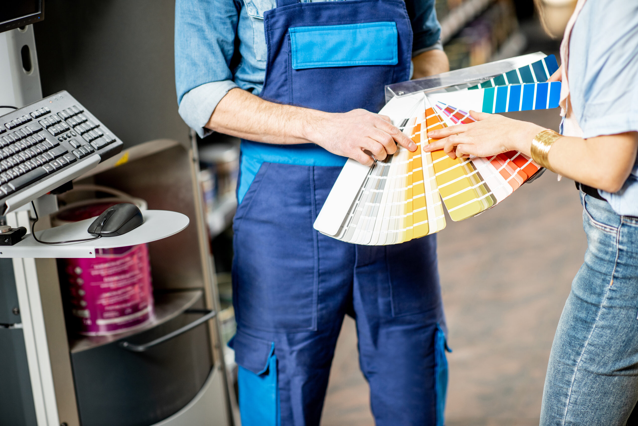 Choosing paints in the building shop Reliaco Painting Fishers, IN